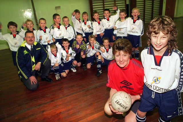 Angela Lunn, manager of Gildersome Spurs U-9s football team with first team captain Andrew Slater wearing the new kit presented to them by Dennis Cook (pictured) of Rawcliffe's in the city centre after their old strip was stolen. Pictured in December 1997.