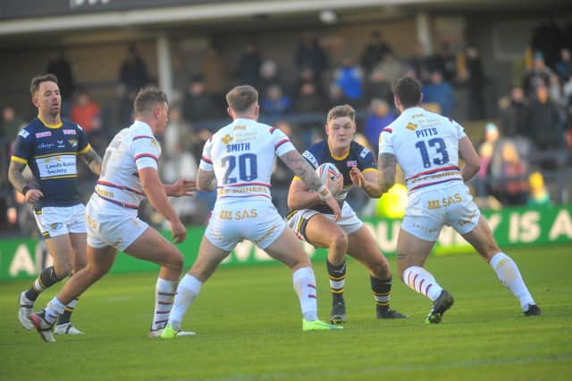 James McDonnell on the ball for Rhinos during his first appearance, against Wakefield at Christmas. Picture by Steve Riding.