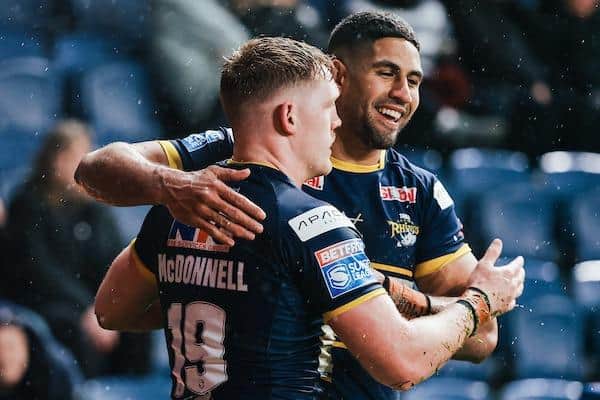 McDonnell (James) and Macdonald (Nene) celebrate the former's try which opened Rhinos' account against Hull. Picture by Alex Whitehead/SWpix.com.