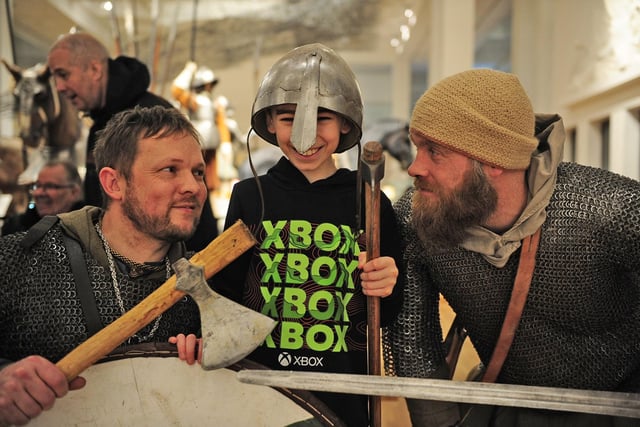 Roan Quinn, 11 of Morley with Jarl Magnus  Gunnarson and Odd trying out Viking items.