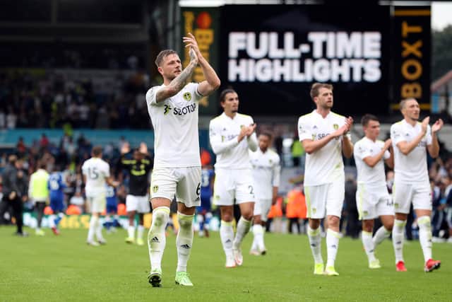 LEEDS, ENGLAND - AUGUST 21: Liam Cooper of Leeds leads his team around the pitch acknowledging the fans during the Premier League match between Leeds United  and  Everton at Elland Road on August 21, 2021 in Leeds, England. (Photo by Jan Kruger/Getty Images)