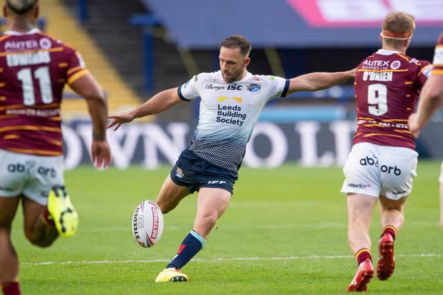 Luke Gale kicks the golden-point drop goal against Huddersfield Giants which took Leeds Rhinos top opf Betfred Super League in August, 2020. Picture by Allan McKenzie/SWpix.com.