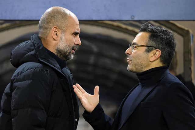 TALKS ONGOING - Leeds United majority owner Andrea Radrizzani, pictured with Man City boss Pep Guardiola, was not present at Elland Road to see his club relegated on Sunday and nor were the 49ers, who remain keen on a takeover. Pic: Getty