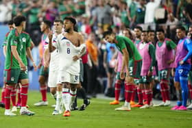 MARCHING ORDERS: For ex-Leeds United midfielder Weston Mckennie, centre, pictured with his ripped shirt after the scuffle against Mexico in the CONCACAF Nations League semi-final at Allegiant Stadium in Las Vegas, Nevada. Photo by Louis Grasse/Getty Images.