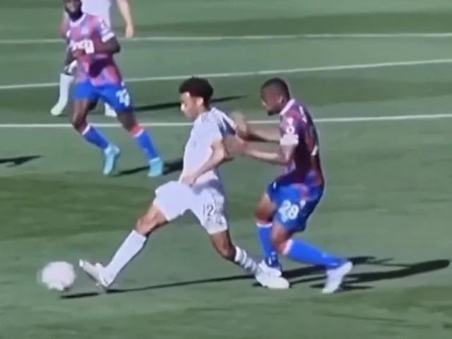 Crystal Palace's Cheikh Doucoure escapes a red card for this tackle on Tyler Adams (Pic: Premier League)