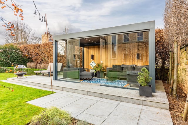 The property boasts this stunning garden room to relax in.