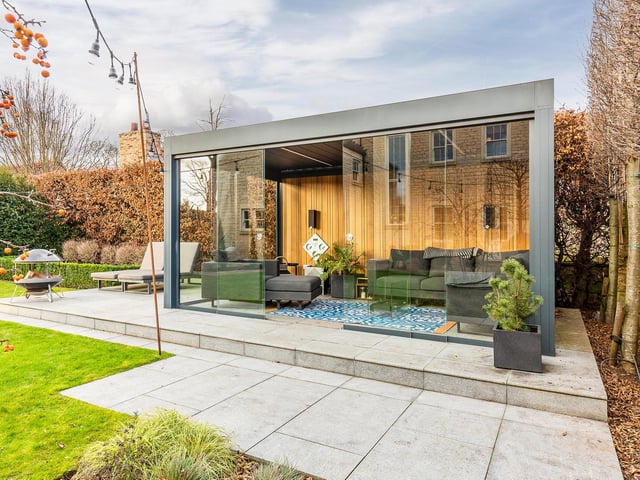 The property boasts this stunning garden room to relax in.
