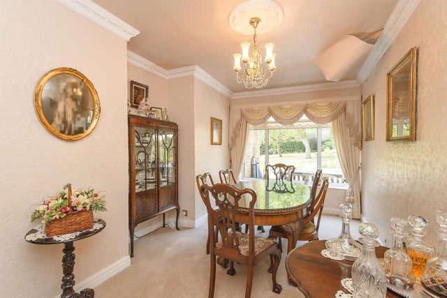 A formal dining area with a lovely outlook.