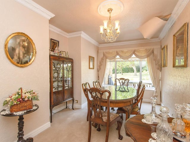 A formal dining area with a lovely outlook.