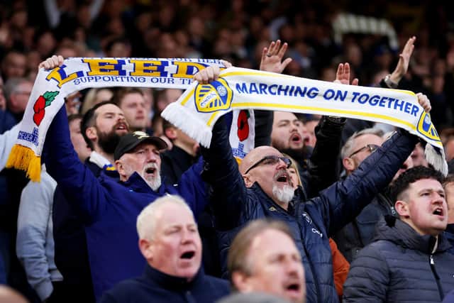 LEEDS, ENGLAND - APRIL 25: Leeds United fans show their support with scarfs during the Premier League match between Leeds United and Leicester City at Elland Road on April 25, 2023 in Leeds, England. (Photo by Alex Livesey/Getty Images)