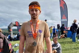 Tom Hill after finishing the Tough Mudder challenge