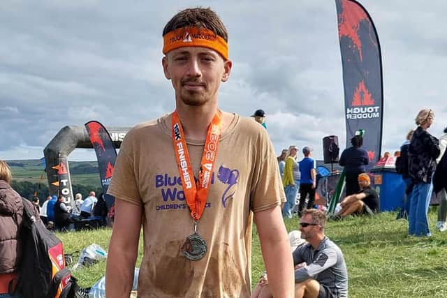Tom Hill after finishing the Tough Mudder challenge