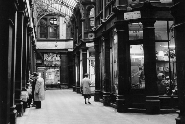 Swan Arcade in Bradford pictured in October 1961 showing the junction of East Avenue and South Parade. Shops in focus are Knight and Forster and Evelys.
