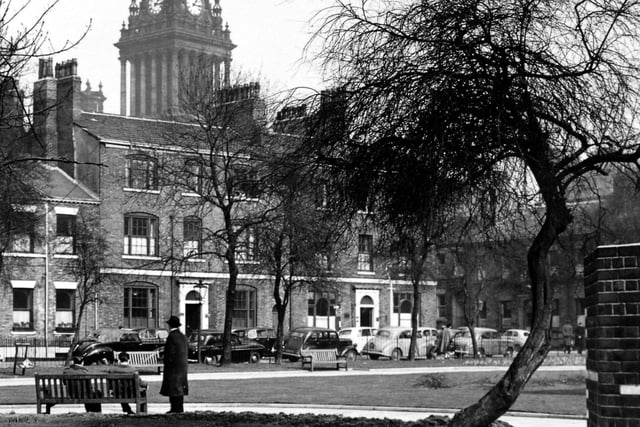 Park Square with the domed clock tower of the Town Hall in the background pictured in March 1956. The Georgian buildings seen are on the north side of the square. Park Square East is visible behind the tree on the right.