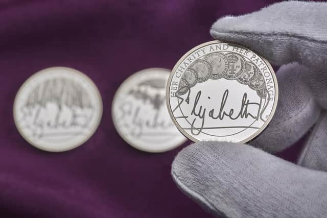 The £5 coin collection celebrates the Queen's life-long service and features the monarch's signature for the first time on a UK coin. PIC: Royal Mint/PA Wire