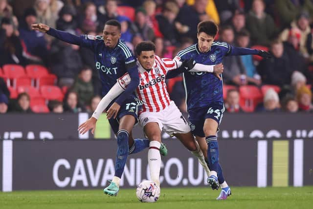 SUPPORTING CAST - Jaidon Anthony and Ilia Gruev of Leeds United challenge for the ball with Ki-Jana Hoever of Stoke City during their Sky Bet Championship match. Pic: Nathan Stirk/Getty Images