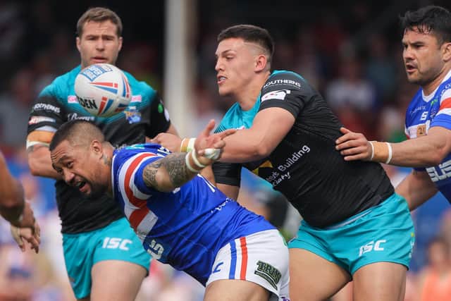 Owen Trout forces the ball loose from Wakefield Trinity's Tinirau Arona during one of his three first team appearances for Leeds Rhinos in 2019. Picture by Alex Whitehead/SWpix.com.