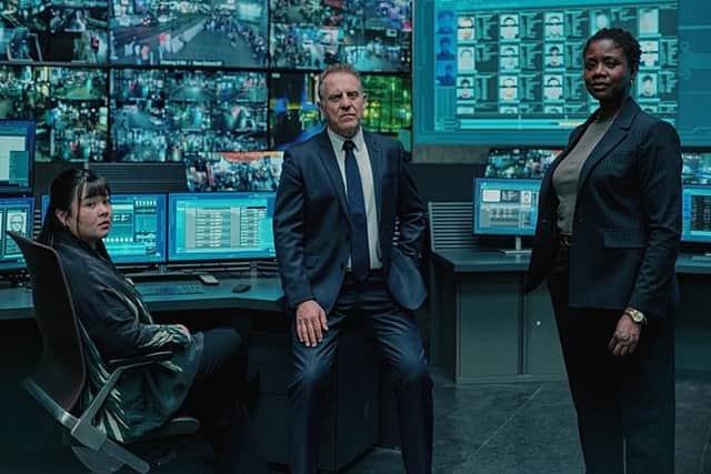 The enormo-screens are back in the new series of tech-thriller The Capture, along with Tessa Wong as DC Chloe Tan, Nigel Lindsay as DSI Tom Kendricks and Ginny Holder as DI Nadia Latif (Picture: BBC/Universal International Studios/Laurence Cendrowicz)