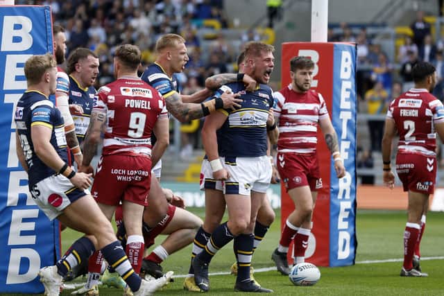 Tom Holroyd celebrates after opening the scoring for Rhinos against Wigan. Picture by Richard Sellers/PA Wire.