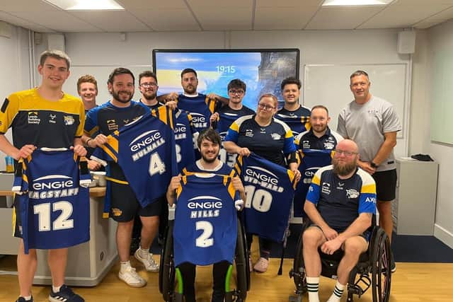 Leeds Rhinos legend Danny McGuire, right of picture, presented the club's wheelchair side with their playing jerseys for Saturday's Challenge Cup final agianst Halifax Panthers. Picture by James Simpson.