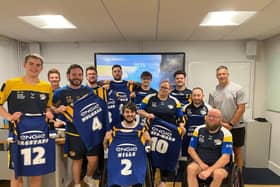 Leeds Rhinos legend Danny McGuire, right of picture, presented the club's wheelchair side with their playing jerseys for Saturday's Challenge Cup final agianst Halifax Panthers. Picture by James Simpson.