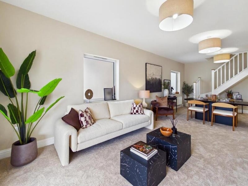 The living room is carpeted throughout and has central heated radiators and UPVC double glazed windows to the side elevations.