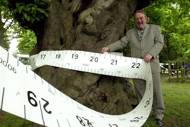 TV Weatherman Ian McCaskill measuring the age of trees in Temple Newsam Park in 2000, where he launched the Great Trees of Yorkshire  campaign, which hoped to raise awareness of trees and their importance in our everyday lives.