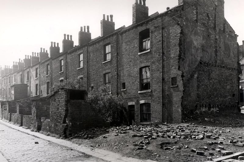 Back Glover Street in July 1958. These were through houses with entrances on Glover Street. Number 50 is the house just in from the left with an extension. Moving right, 62 is at the end, next to the cleared site.
