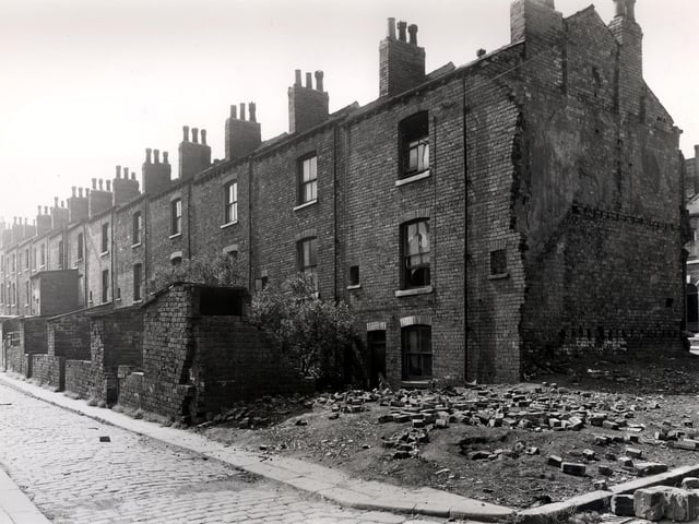 Back Glover Street in July 1958. These were through houses with entrances on Glover Street. Number 50 is the house just in from the left with an extension. Moving right, 62 is at the end, next to the cleared site.