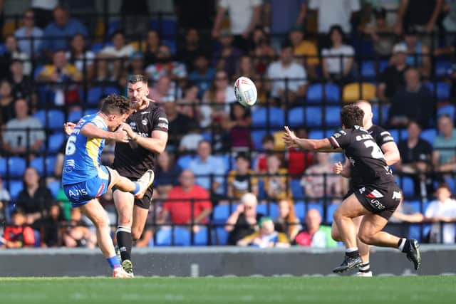 Brodie Croft boots the winning golden-point drop goal for Leeds Rhinos at London Broncos. Picture by John Clifton/SWpix.com.
