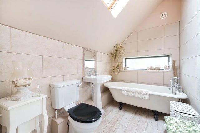 The family bathroom is a three-piece suite with a roll-top bath, wash hand basin and a low level WC.