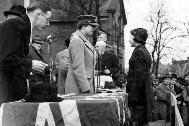 A photograph taken outside Council offices with Marsh Street in April 1944. Primitive Methodist Chapel in the background. Taken to commemorate the visit of the Princess Royal in Salute the Soldier Week. Pictured are Cllr. E. Horner, T.J. Brooks M.P. H.R.H. Princess Mary (The Princess Royal), E.F. Moorhouse, Lt. Col. Longden, Miss Beryl Green( School Child ), P.R. Farrer, Councillor W. Hoult.