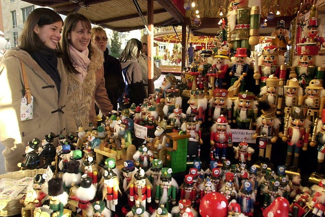 Clare Withnall and Kirstie Young admiring some of the Christmas decorations on one of the stalls back in 2003.