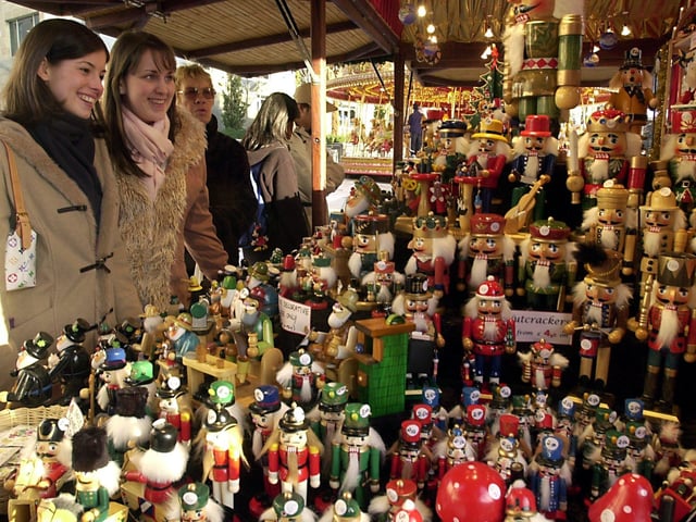 Clare Withnall and Kirstie Young admiring some of the Christmas decorations on one of the stalls back in 2003.