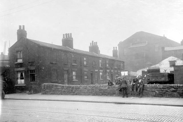 Canaan Square in August 1929. It was located off Low Road, between Bower Street and Whitfield Street. in focus are a row of Terrace houses and business of Clifford Wood, furniture dealer. Large building behind is Waterloo Methodist Chapel, which fronted onto Waterloo Road.