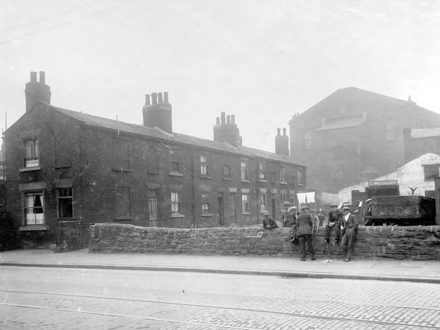 Canaan Square in August 1929. It was located off Low Road, between Bower Street and Whitfield Street. in focus are a row of Terrace houses and business of Clifford Wood, furniture dealer. Large building behind is Waterloo Methodist Chapel, which fronted onto Waterloo Road.