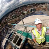 Graeme Atkinson, the construction manager at the Bridgewater Place, the tallest building in Leeds, stands on the top floor of the building the 31st floor, with a view of Leeds city centre in the background.