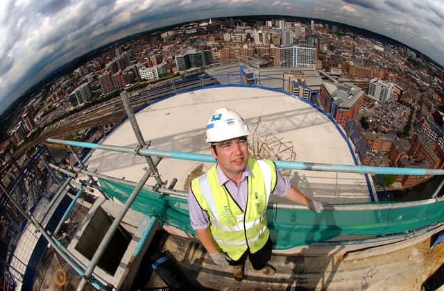 Graeme Atkinson, the construction manager at the Bridgewater Place, the tallest building in Leeds, stands on the top floor of the building the 31st floor, with a view of Leeds city centre in the background.