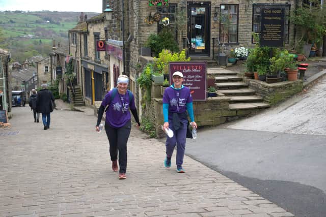 Competitors in Forget Me Not children's hospice's Race Across West Yorkshire arrive in Haworth