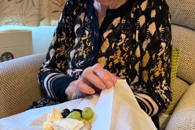 Resident at HC-One’s Ashworth Grange Care Home enjoying cheese and wine