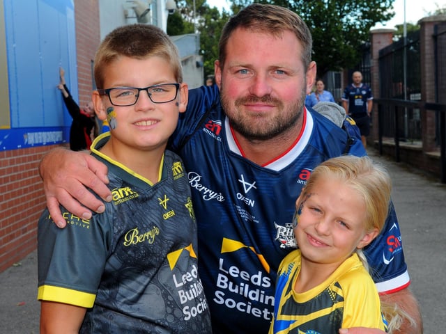 Rhinos fans, Lucas Wisniewski, Tony, aged 10, and Mia, seven, of Leeds.