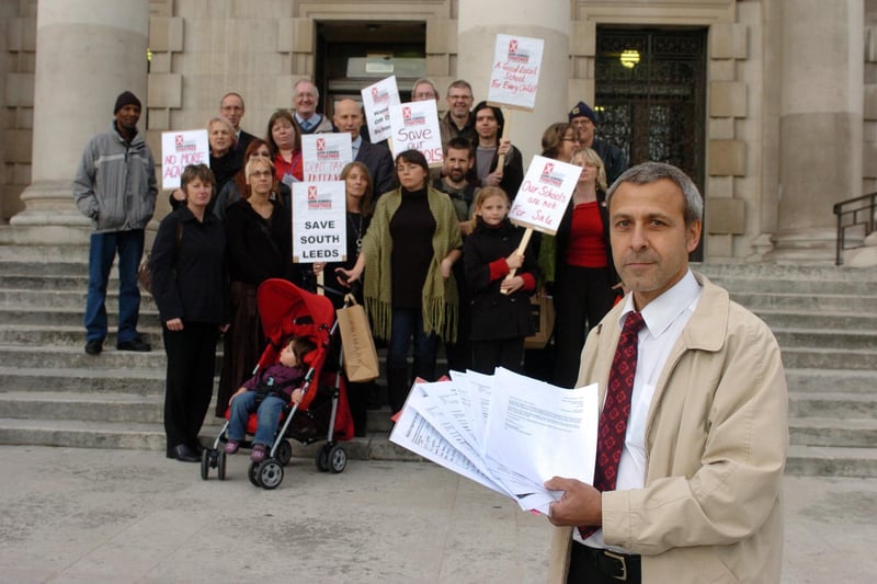 October 2008 and pictured is Paul Walton, NUT representative at South Leeds High School holds  petitions with protestors gathered on the steps at Leeds Civic Hall opposing plans to change South Leeds High School and Intake High School into an academy.
