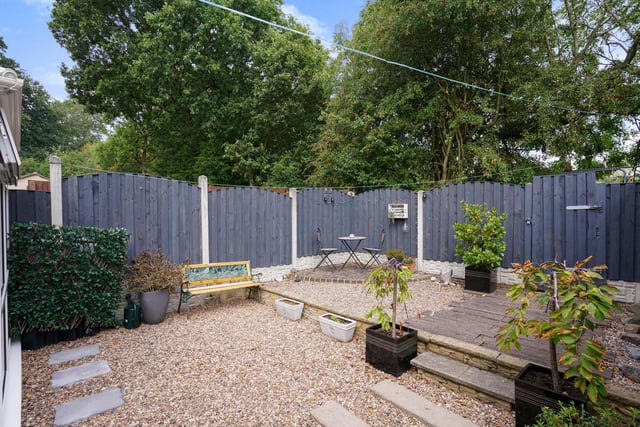 There is also a wonderful low maintenance enclosed rear garden, a large driveway with off street parking for several cars, a garage and views to the rear over Skelton Woods.