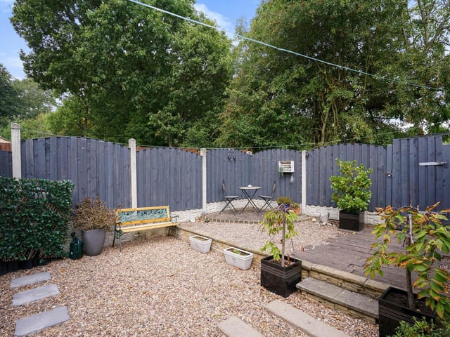 There is also a wonderful low maintenance enclosed rear garden, a large driveway with off street parking for several cars, a garage and views to the rear over Skelton Woods.
