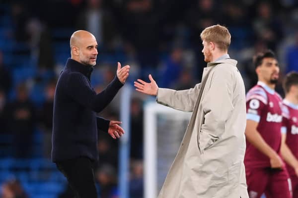 MANCHESTER, ENGLAND - MAY 03: Kevin De Bruyne (R) and Pep Guardiola (L) of Manchester City reacts after the team's victory during the Premier League match between Manchester City and West Ham United at Etihad Stadium on May 03, 2023 in Manchester, England. (Photo by Stu Forster/Getty Images)