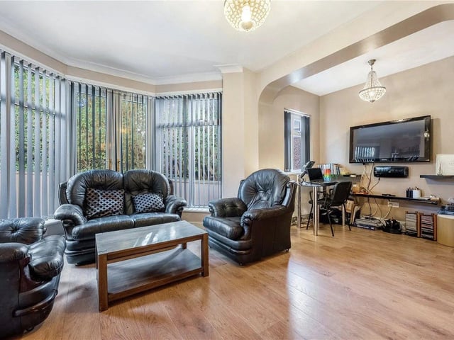 There is a large, bright and airy living room to the front of the property, with a lovely feature modern gas fire and double French doors leading into the sun room