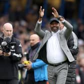 LEEDS, ENGLAND - MARCH 11: Former Leeds United player Lucas Radebe applauds the fans prior to the Premier League match between Leeds United and Brighton & Hove Albion at Elland Road on March 11, 2023 in Leeds, England. (Photo by George Wood/Getty Images)