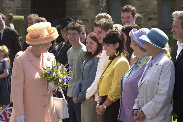 The Queen meets members of the cast of Emmerdale cast during her visit to the set at Harewood.