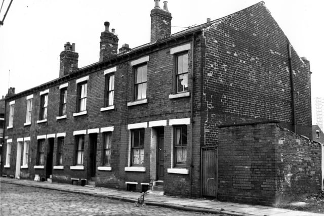 Ashfield Street in August 1967. This view is from the waste ground, locally known as 'Buggy Park'.