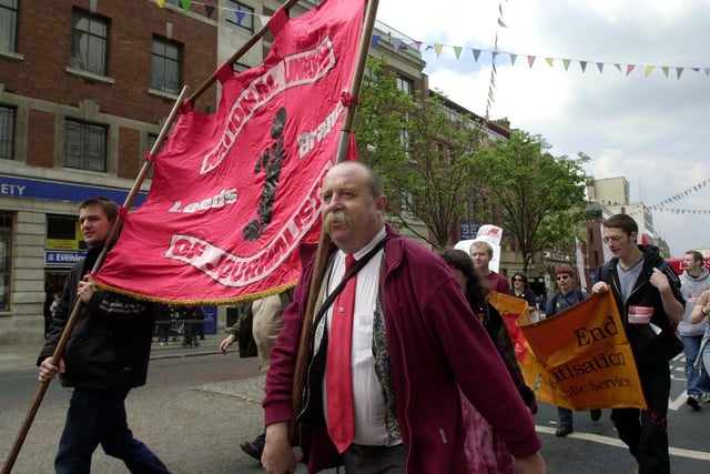 People pictured marching through Leeds city centre during the traditional May Day rally.